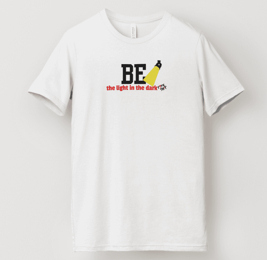 Picture of a chicago illinois company typeshit t-shirt that says be the light in the dark